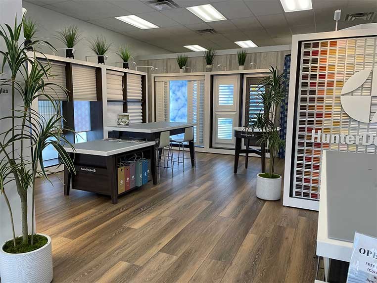 Store interior showcasing several different types of window coverings