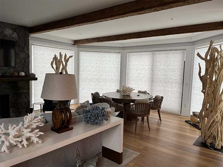 Eclectic dining room with large, semi-transparent window shades